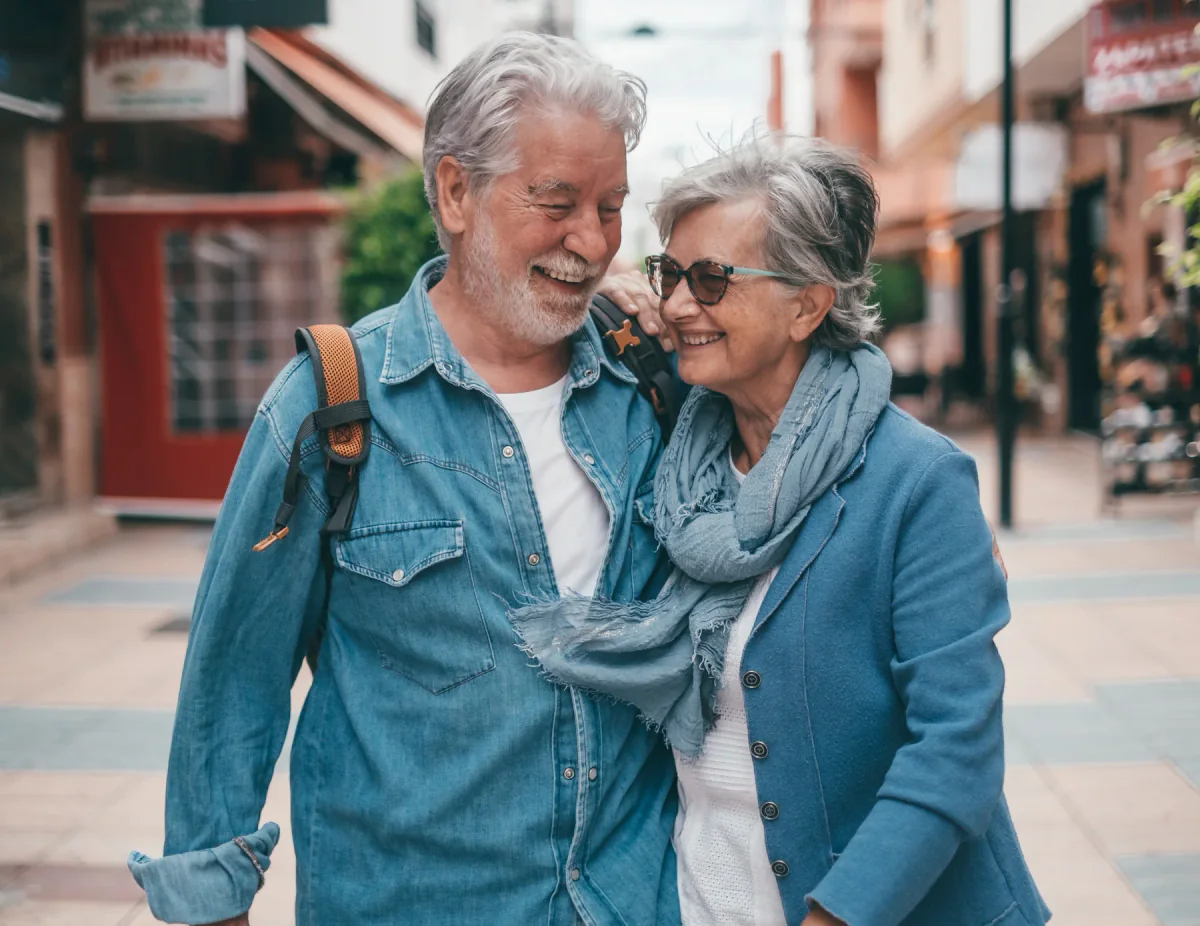 Smiling older couple walking together