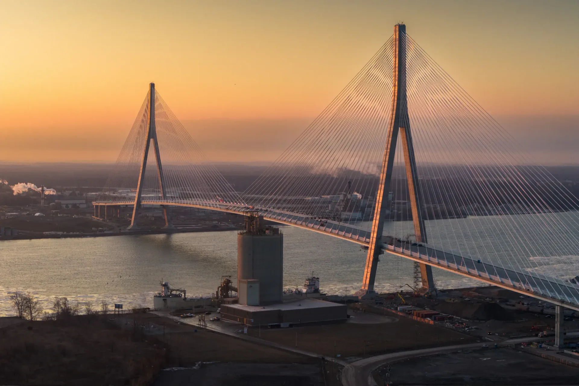 Cable-stayed bridge illuminated by warm sunset light
