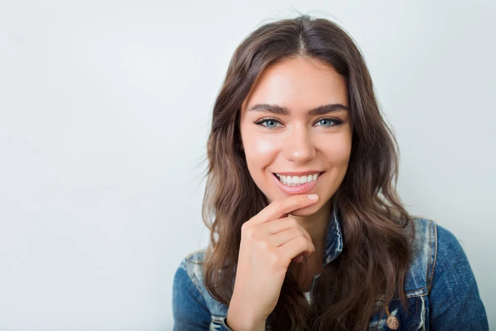 Smiling woman in a denim jacket